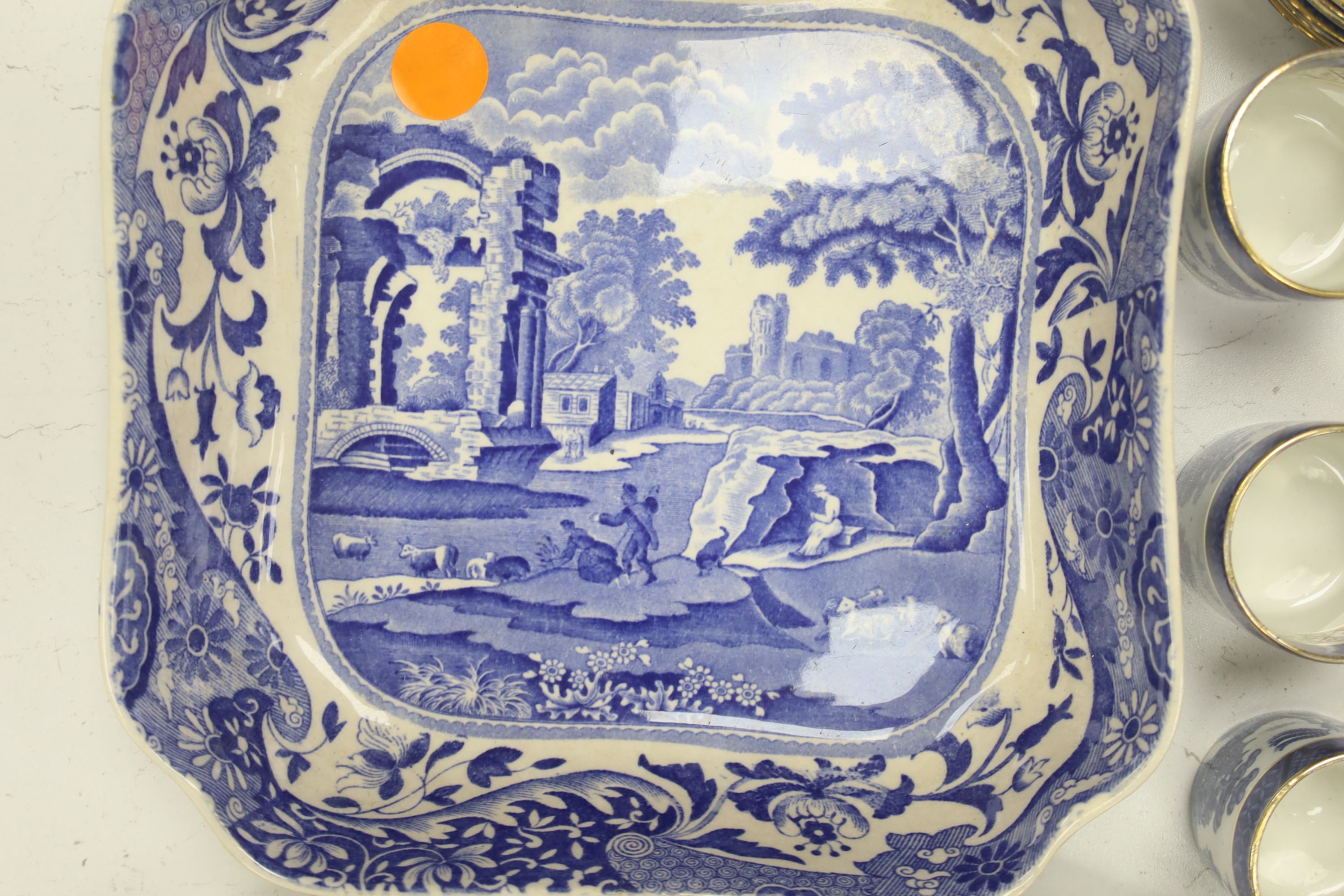 A Wedgwood blue and white willow pattern meat dish, a Copeland Spode Tower pattern square shaped bowl & a blue and white coffee pot (3)